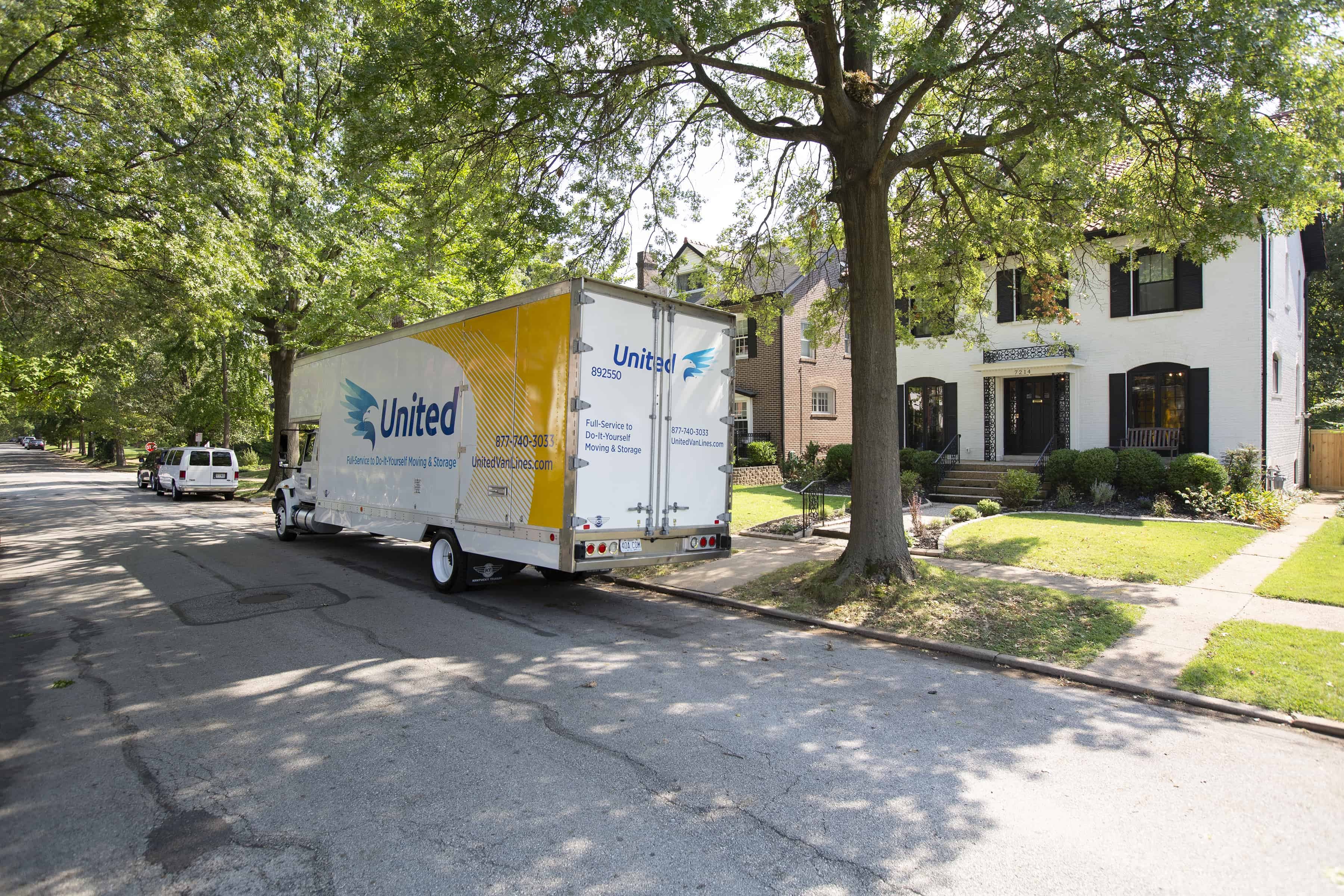 United moving truck outside of a home on a residential street - United Van Lines®