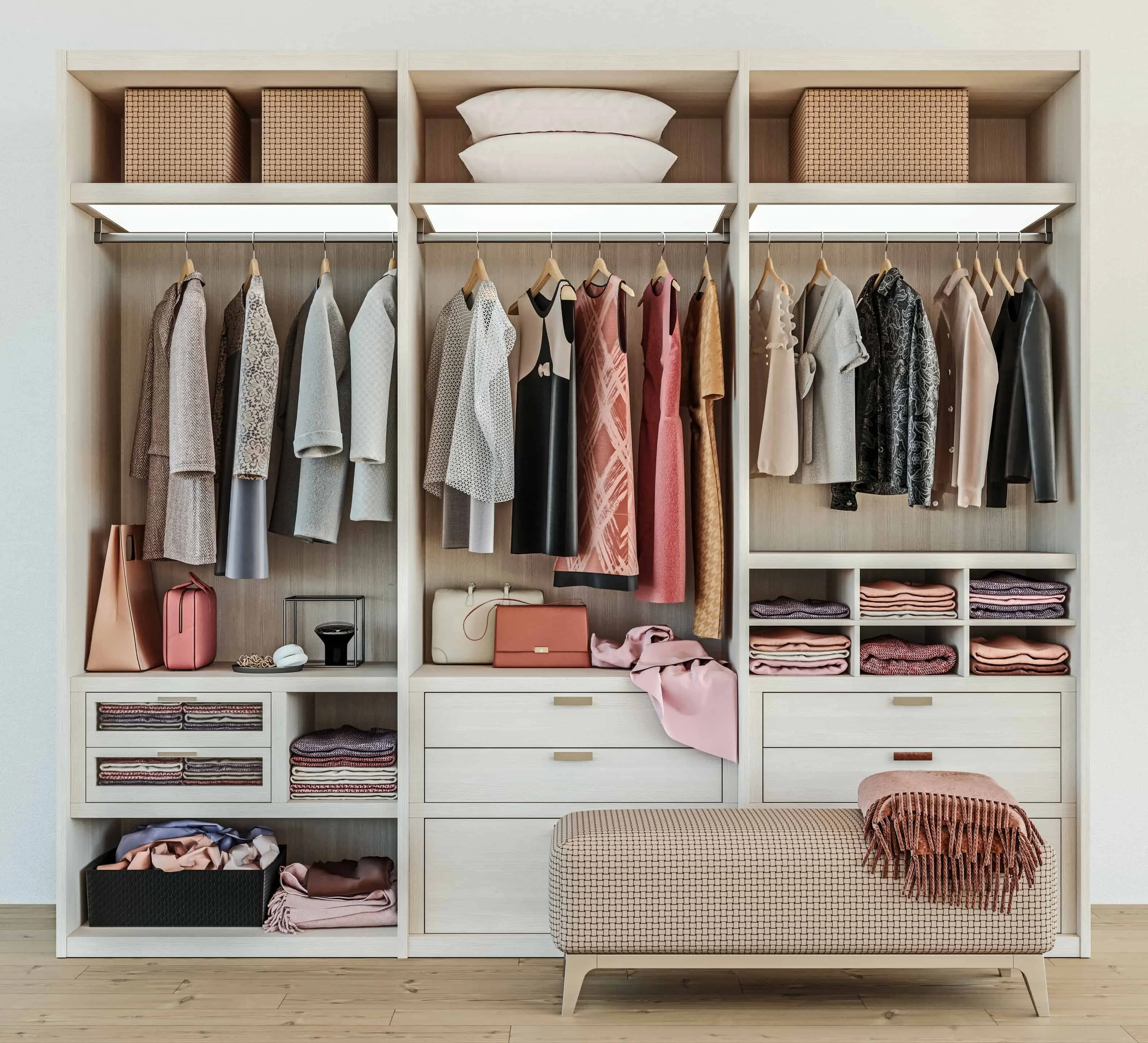 How to Pack Your Bedroom - modern wooden wardrobe with women clothes hanging on rail in walk in closet design interior, 3d rendering- United Van Lines