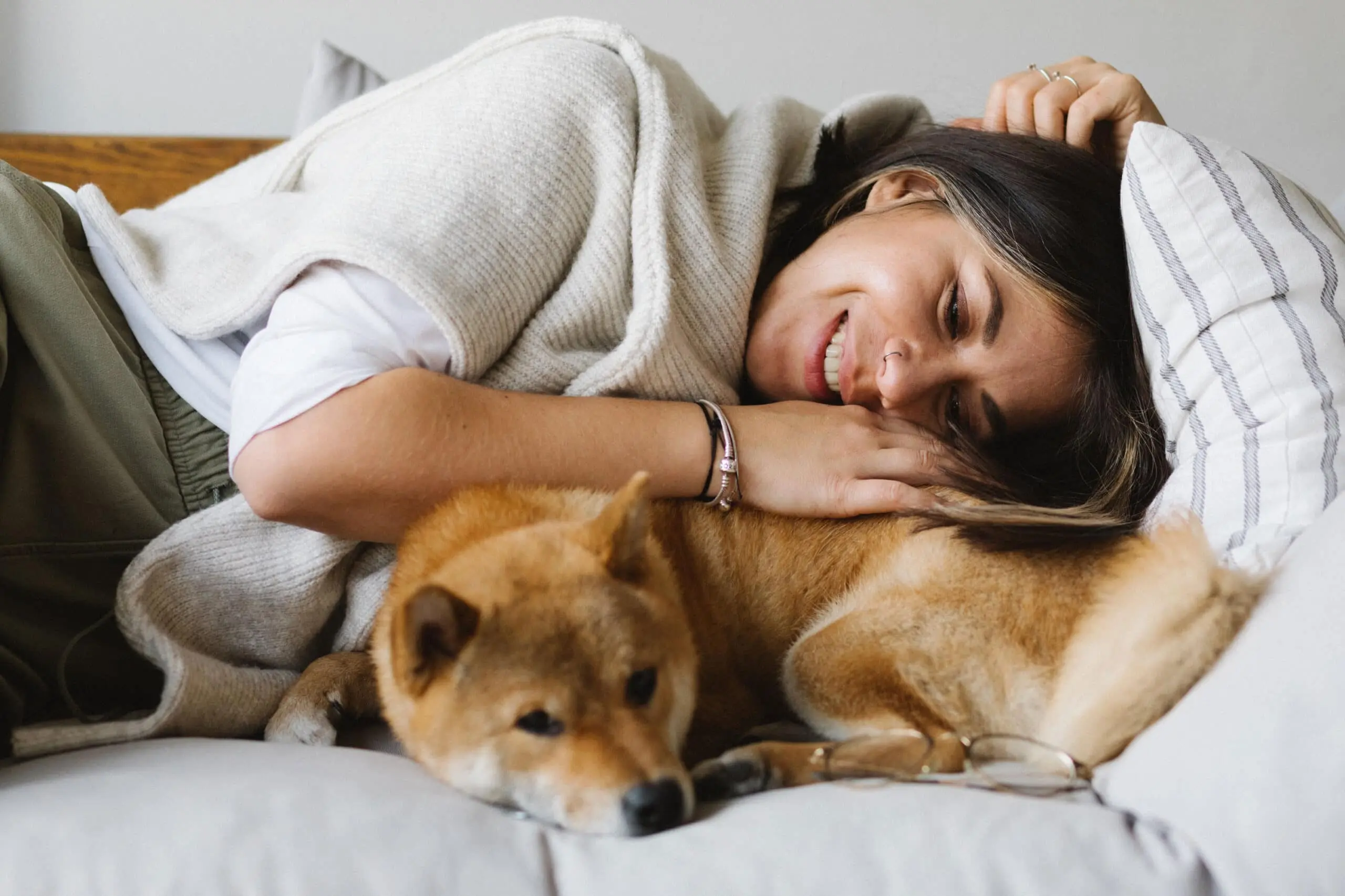 woman cuddling with a dog